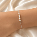 PULSEIRA FINA COM PEROLAS
